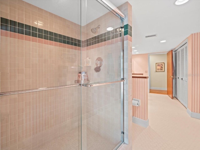 bathroom featuring recessed lighting, baseboards, visible vents, and a stall shower