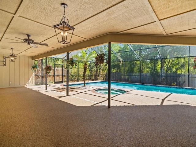 view of swimming pool featuring a fenced backyard, a patio, a pool with connected hot tub, and a lanai