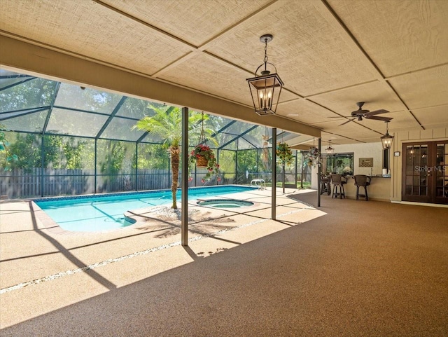 view of swimming pool featuring ceiling fan, a fenced in pool, a fenced backyard, an in ground hot tub, and a patio area