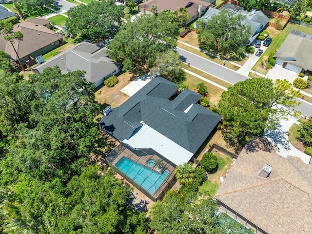 birds eye view of property with a residential view