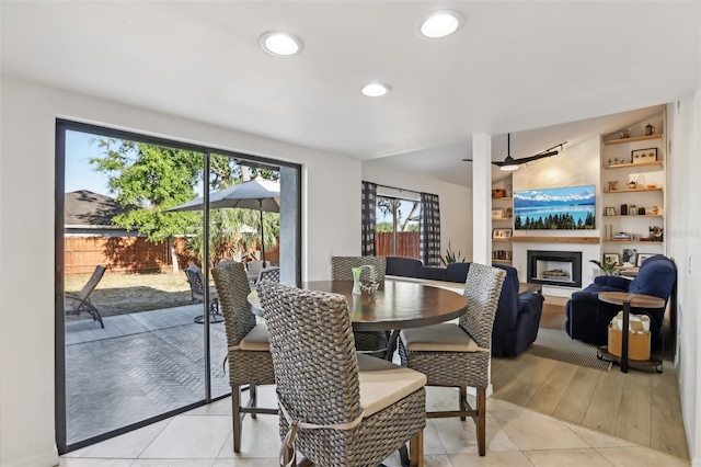 1502 Creekbend Dr, Brandon, FL 33510 - dining area featuring a fireplace with raised hearth and recessed lighting