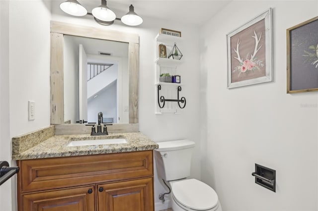1502 Creekbend Dr, Brandon, FL 33510 - half bathroom featuring vanity, visible vents, and toilet