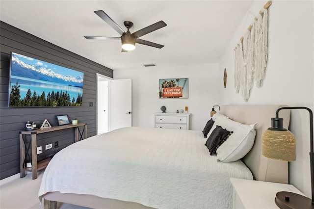 1502 Creekbend Dr, Brandon, FL 33510 - bedroom featuring wooden walls, ceiling fan, and visible vents