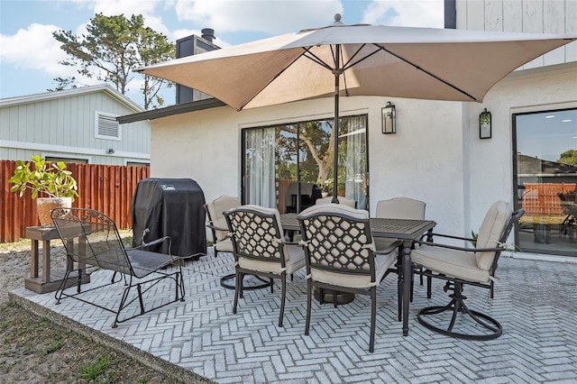 1502 Creekbend Dr, Brandon, FL 33510 - view of patio / terrace with outdoor dining area, fence, and grilling area