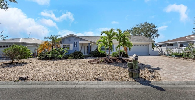 6321 Balboa Ln, Apollo Beach, FL 33572 - ranch-style home featuring fence, an attached garage, stucco siding, and decorative driveway