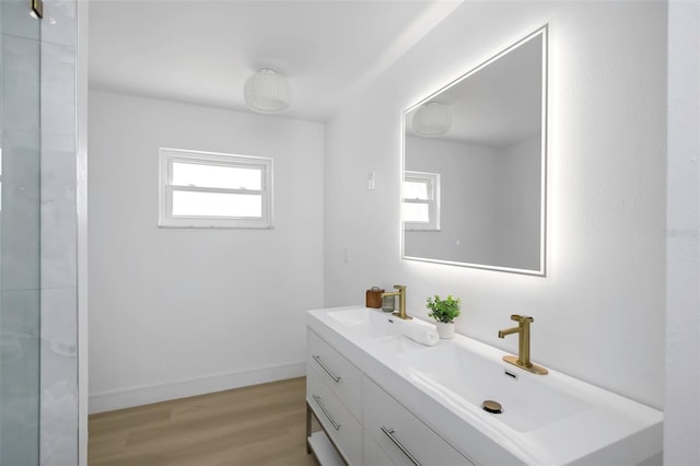 6321 Balboa Ln, Apollo Beach, FL 33572 - full bath featuring double vanity, a sink, baseboards, and wood finished floors