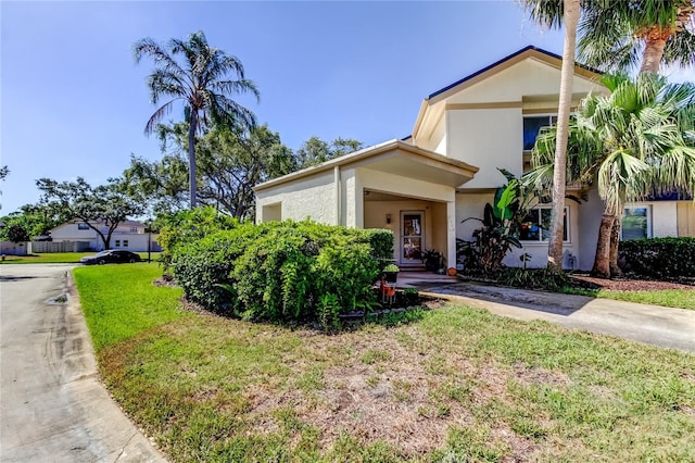2600 Forest Run Ct, Clearwater, FL 33761 - view of front of house with a front yard and stucco siding