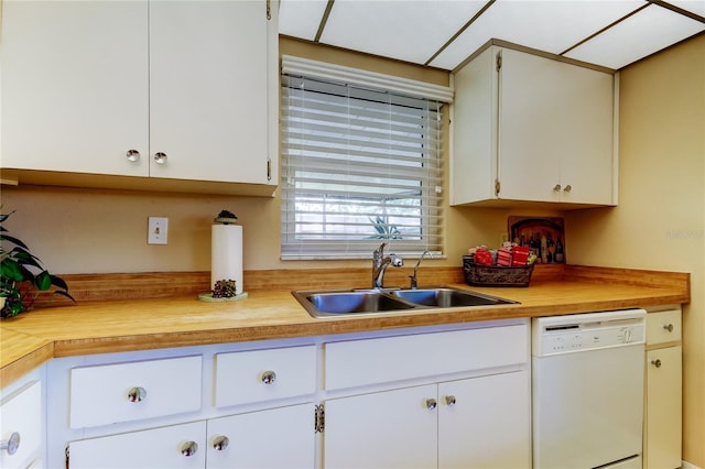 2600 Forest Run Ct, Clearwater, FL 33761 - kitchen featuring dishwasher, a sink, white cabinetry, and wooden counters