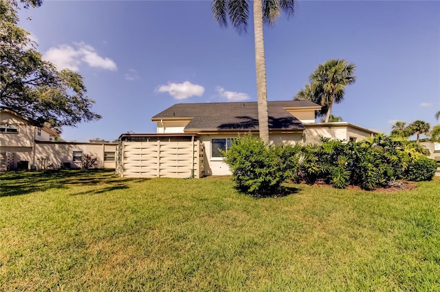 2600 Forest Run Ct, Clearwater, FL 33761 - rear view of property with a yard and stucco siding