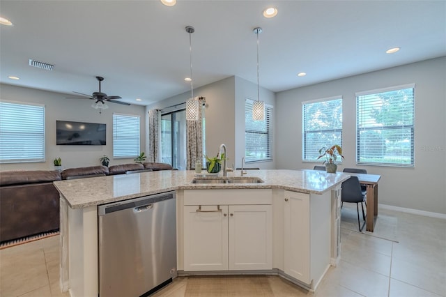 kitchen with visible vents, a sink, dishwasher, and light stone countertops