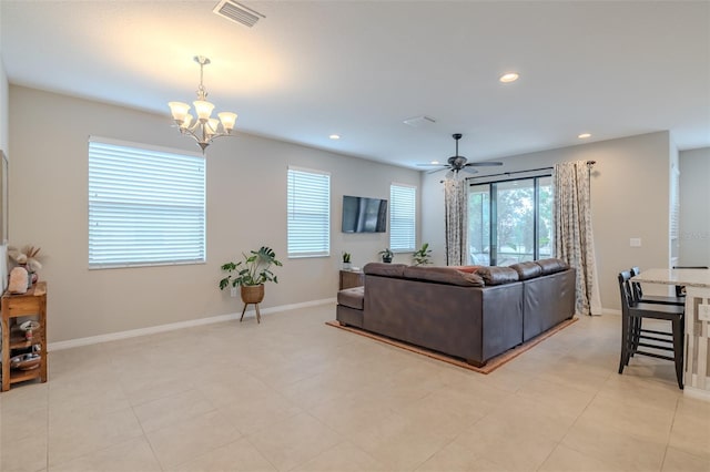 living room with visible vents, recessed lighting, baseboards, and ceiling fan with notable chandelier