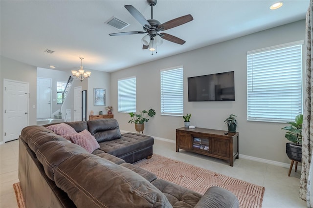 living room with baseboards, ceiling fan with notable chandelier, recessed lighting, and visible vents