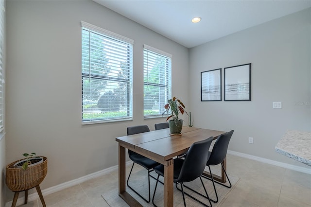 dining area with recessed lighting, baseboards, and light tile patterned floors