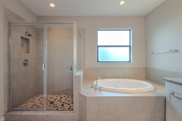 full bath with vanity, recessed lighting, a bath, and a shower stall