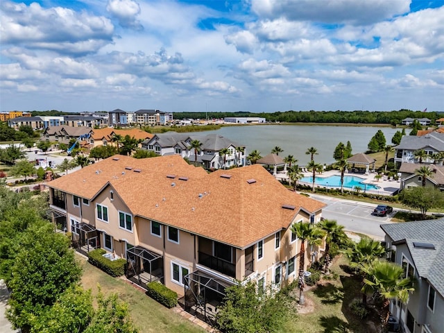 birds eye view of property with a water view and a residential view