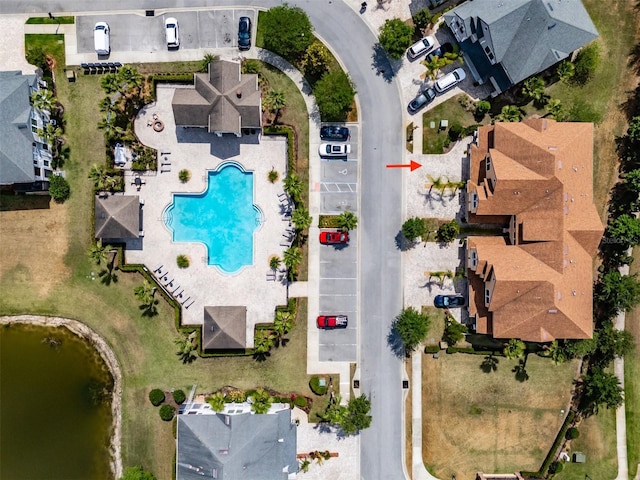 bird's eye view with a water view and a residential view