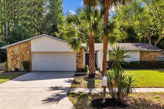 view of front of home with a garage, a front yard, stone siding, stucco siding, and driveway