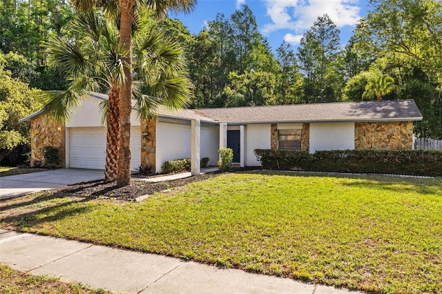 view of front of property featuring stucco siding, driveway, a front lawn, and stone siding