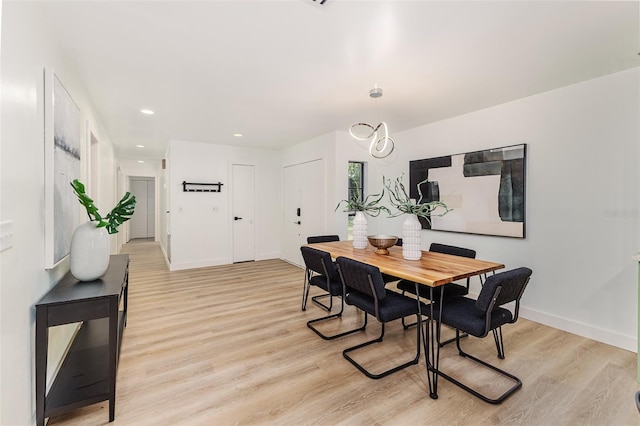 dining room featuring recessed lighting, baseboards, and light wood finished floors