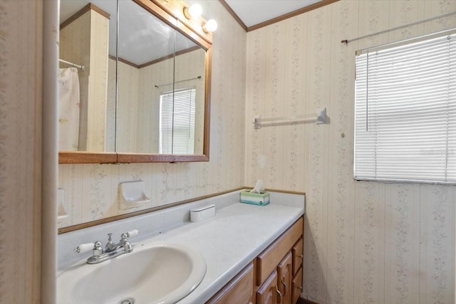 bathroom featuring vanity, ornamental molding, wallpapered walls, and a shower with shower curtain