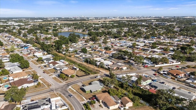 drone / aerial view with a water view and a residential view