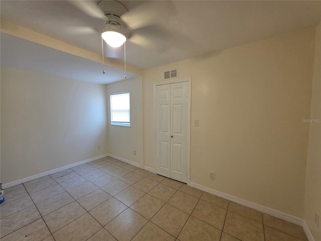 718 Paris Ave S, Saint Petersburg, FL 33701 - empty room with baseboards, a ceiling fan, light tile patterned flooring, and visible vents