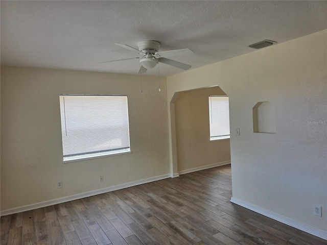 718 Paris Ave S, Saint Petersburg, FL 33701 - unfurnished room featuring a ceiling fan, baseboards, visible vents, and wood finished floors