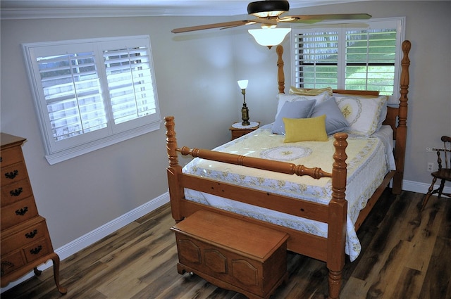 bedroom featuring ceiling fan, baseboards, ornamental molding, and wood finished floors