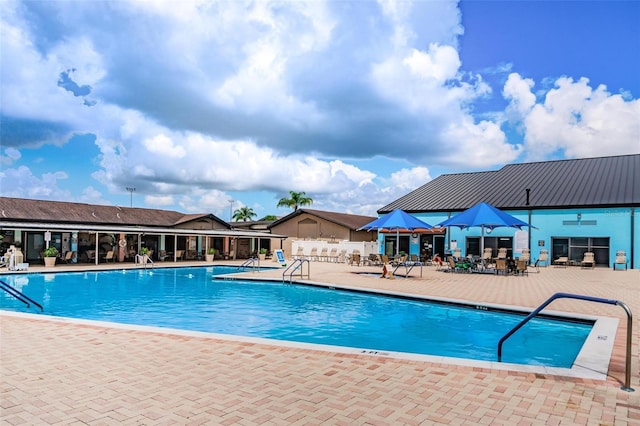 pool featuring a patio and fence