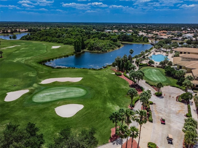 aerial view with a water view and view of golf course