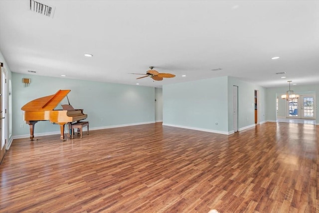 4531 44th St S, Saint Petersburg, FL 33711 - unfurnished living room with recessed lighting, visible vents, and wood finished floors