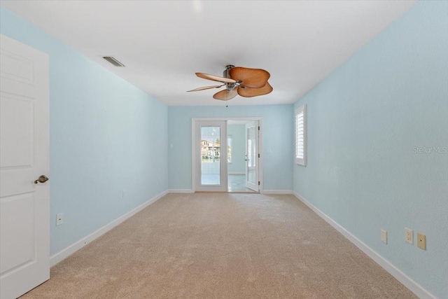 4531 44th St S, Saint Petersburg, FL 33711 - empty room featuring baseboards, ceiling fan, light carpet, and visible vents