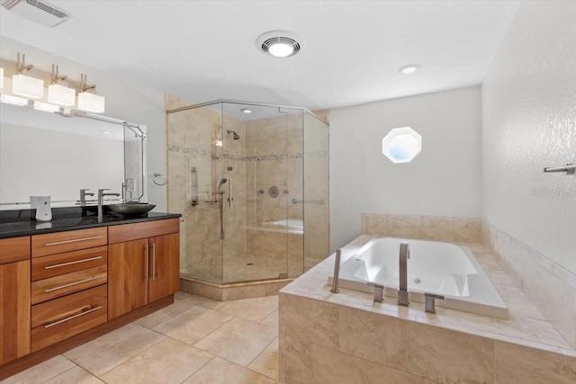 4531 44th St S, Saint Petersburg, FL 33711 - full bathroom with vanity, tile patterned floors, a shower stall, visible vents, and a garden tub