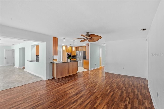 4531 44th St S, Saint Petersburg, FL 33711 - unfurnished living room featuring a ceiling fan, visible vents, baseboards, light wood-style floors, and recessed lighting