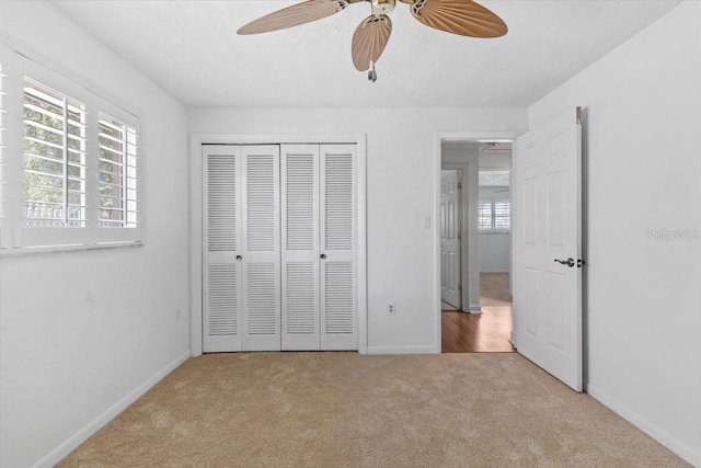 4531 44th St S, Saint Petersburg, FL 33711 - unfurnished bedroom with baseboards, ceiling fan, carpet, and a closet