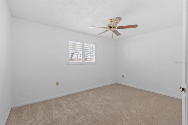 4531 44th St S, Saint Petersburg, FL 33711 - spare room with baseboards, light carpet, and a ceiling fan