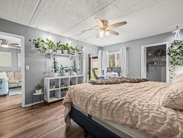 bedroom featuring ceiling fan and wood finished floors