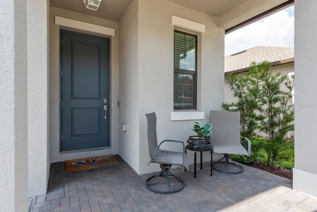 21590 Violet Periwinkle Dr, Land O Lakes, FL 34637 - property entrance with stucco siding
