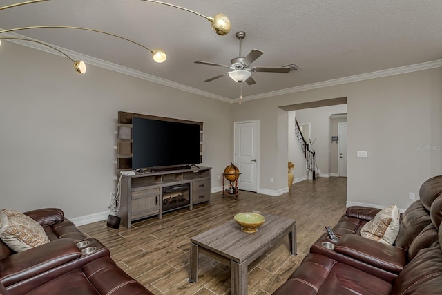 21590 Violet Periwinkle Dr, Land O Lakes, FL 34637 - living area with crown molding, wood finished floors, baseboards, a textured ceiling, and a ceiling fan