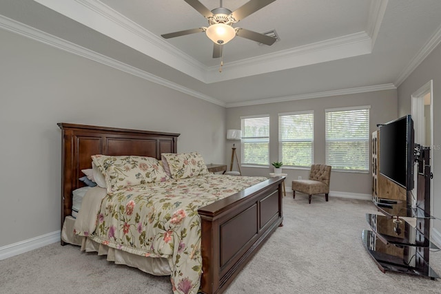 21590 Violet Periwinkle Dr, Land O Lakes, FL 34637 - bedroom featuring ornamental molding, light carpet, a tray ceiling, and visible vents