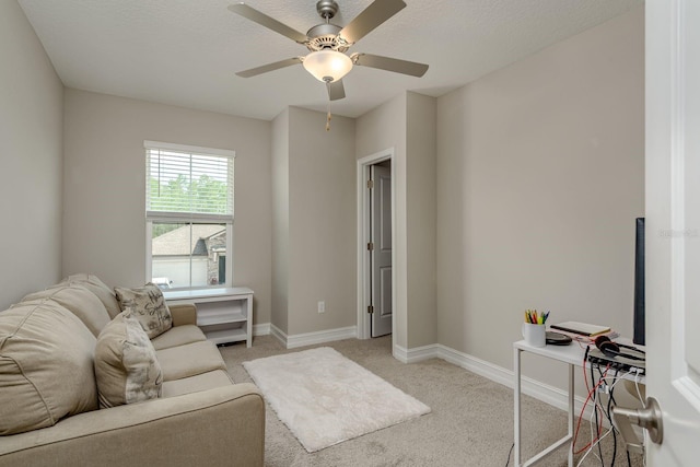 21590 Violet Periwinkle Dr, Land O Lakes, FL 34637 - living area with baseboards, a ceiling fan, and light carpet