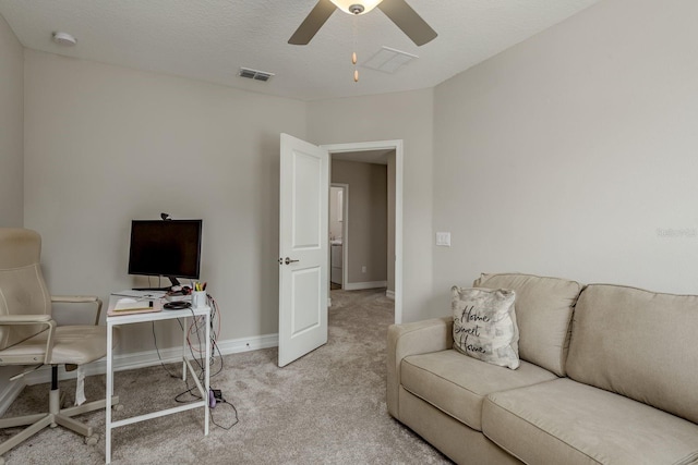 21590 Violet Periwinkle Dr, Land O Lakes, FL 34637 - home office with baseboards, ceiling fan, light carpet, and visible vents