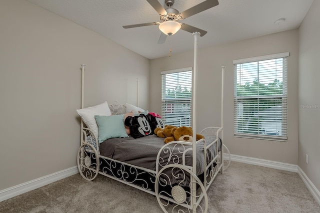 21590 Violet Periwinkle Dr, Land O Lakes, FL 34637 - carpeted bedroom with baseboards and ceiling fan