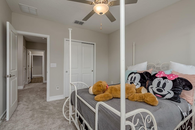 21590 Violet Periwinkle Dr, Land O Lakes, FL 34637 - bedroom with light colored carpet, ceiling fan, visible vents, and baseboards