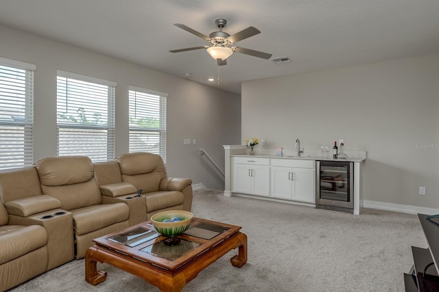 21590 Violet Periwinkle Dr, Land O Lakes, FL 34637 - living room with visible vents, beverage cooler, baseboards, a ceiling fan, and wet bar