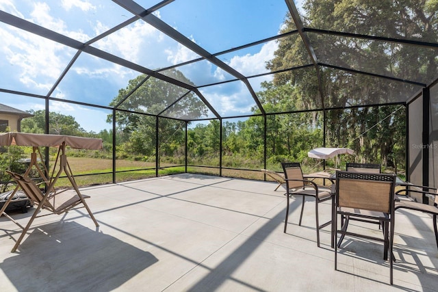 21590 Violet Periwinkle Dr, Land O Lakes, FL 34637 - view of patio / terrace with outdoor dining area and a lanai