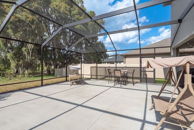 21590 Violet Periwinkle Dr, Land O Lakes, FL 34637 - view of patio / terrace featuring a lanai, outdoor dining area, and a fenced backyard