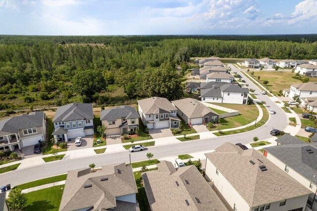 21590 Violet Periwinkle Dr, Land O Lakes, FL 34637 - bird's eye view with a view of trees and a residential view