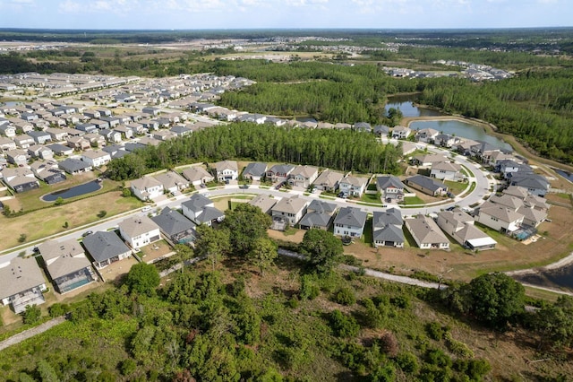 21590 Violet Periwinkle Dr, Land O Lakes, FL 34637 - drone / aerial view featuring a water view, a view of trees, and a residential view
