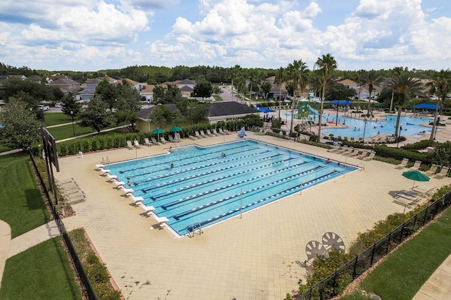 21590 Violet Periwinkle Dr, Land O Lakes, FL 34637 - community pool with a patio and fence